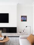 The informal living room with its black stone hearth