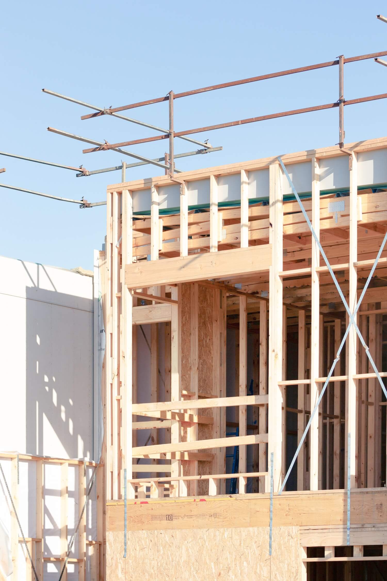 Timber wall frames standing in order