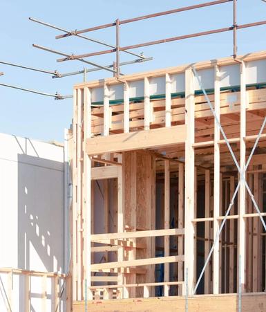 Timber wall frames standing in order
