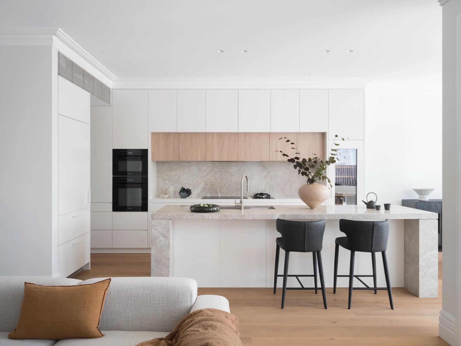 The kitchen in soft white and pale oak