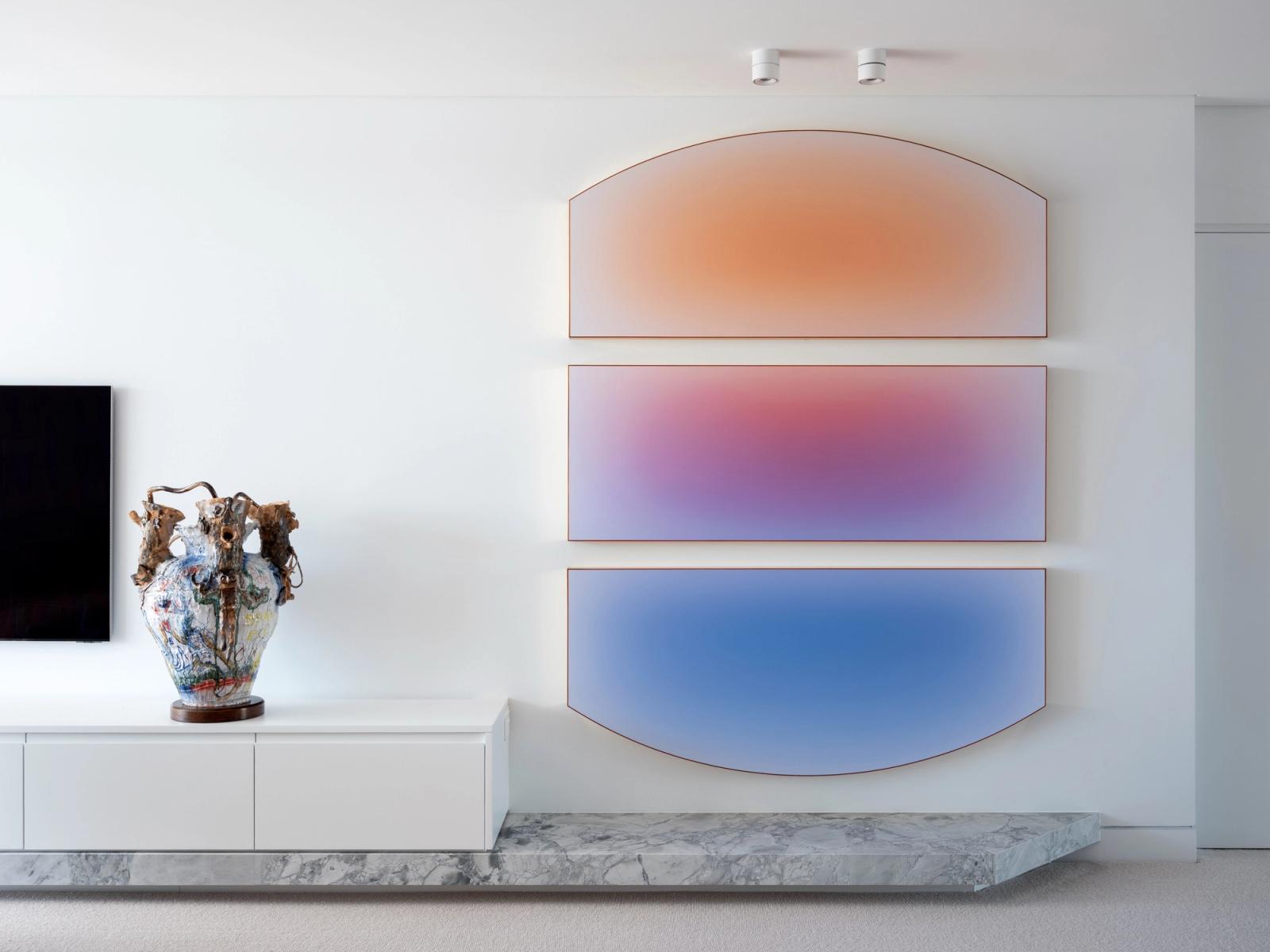 The joinery wall as a clean canvas for the artwork