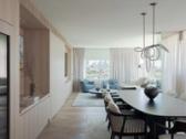 The open-plan living and dining, oriented to the city skyline
