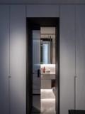 The charcoal-framed doorway through to the ensuite