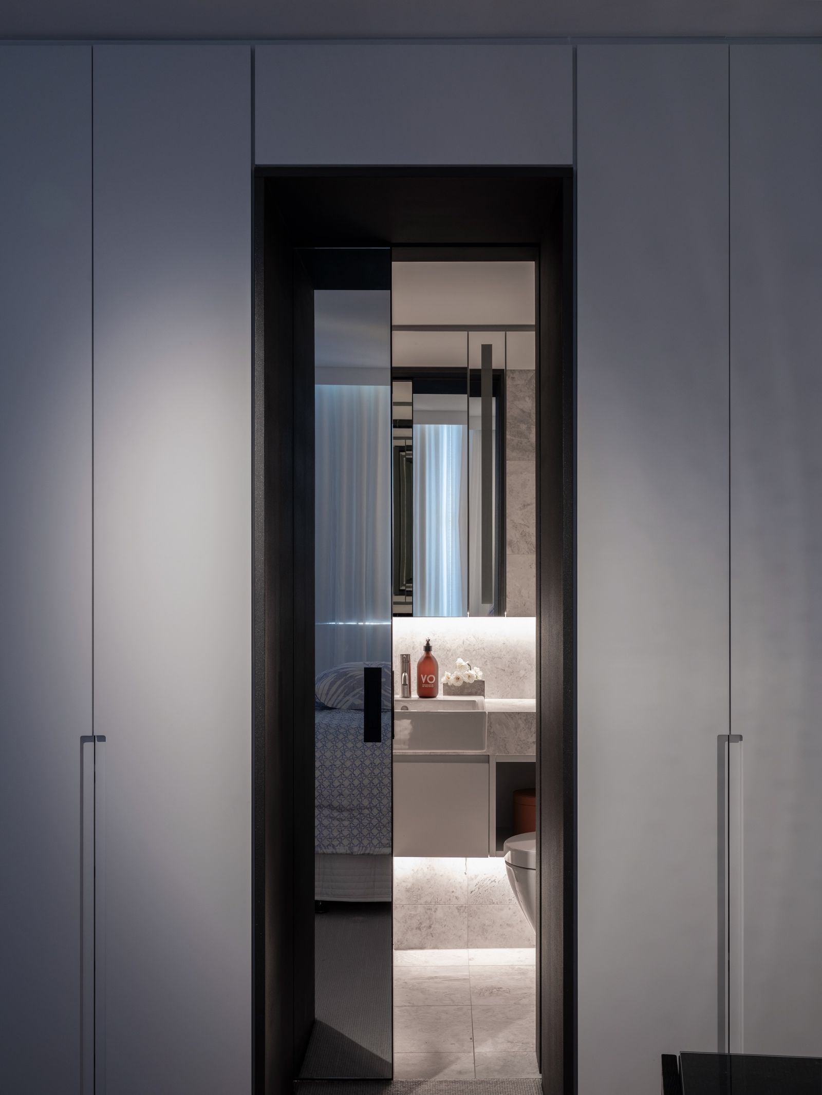 The charcoal-framed doorway through to the ensuite
