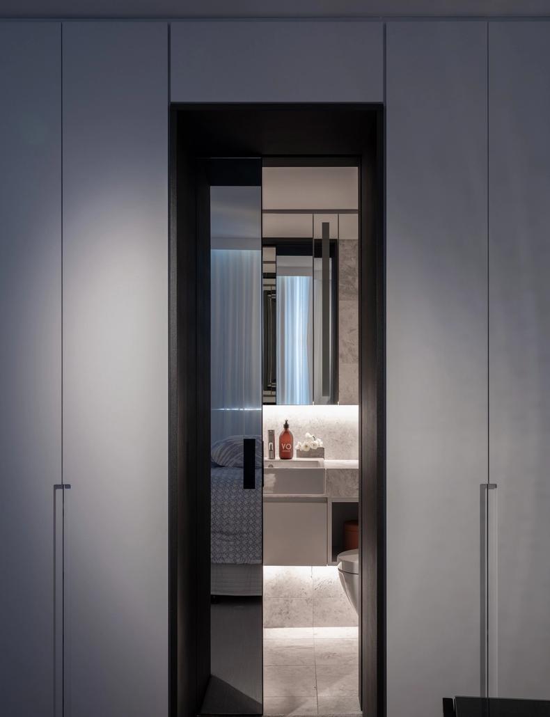 The charcoal-framed doorway through to the ensuite