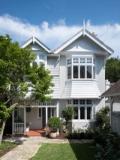The restored weatherboard front elevation with its bay window