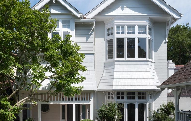 The restored weatherboard front elevation with its bay window