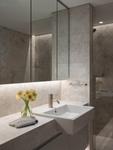 The marble bathroom vanity under full-height mirrored cabinets