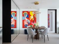 The dining space, mirrors and recessed sliding doors extending the room