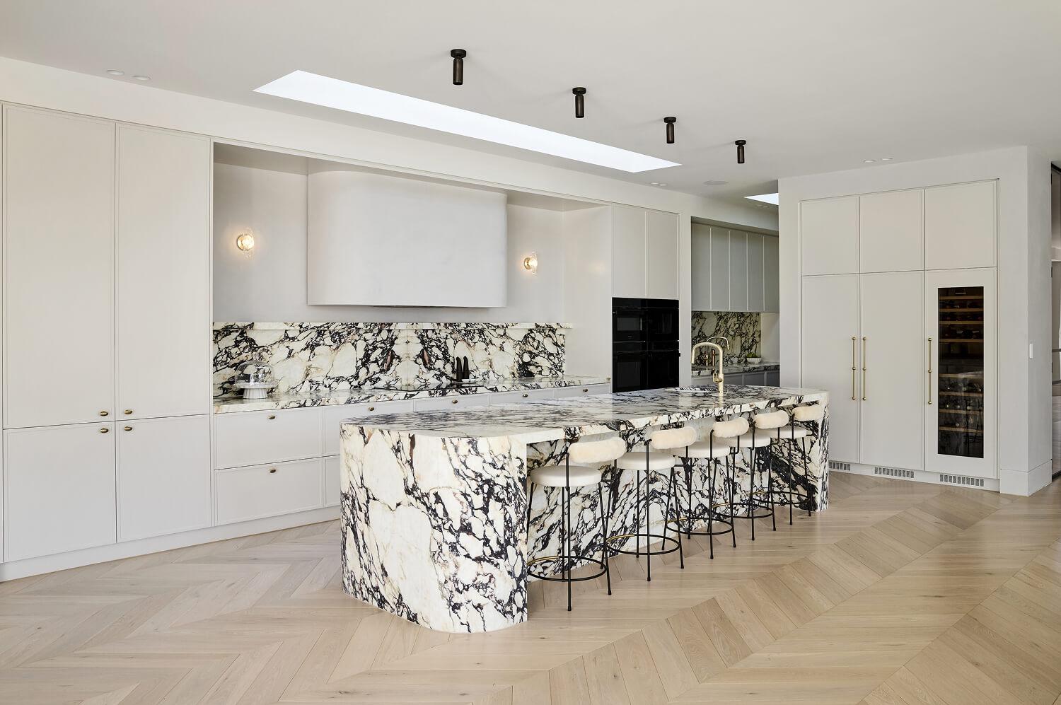 A Thomas Archer architecturally designed custom kitchen with statement Calacatta Viola stone