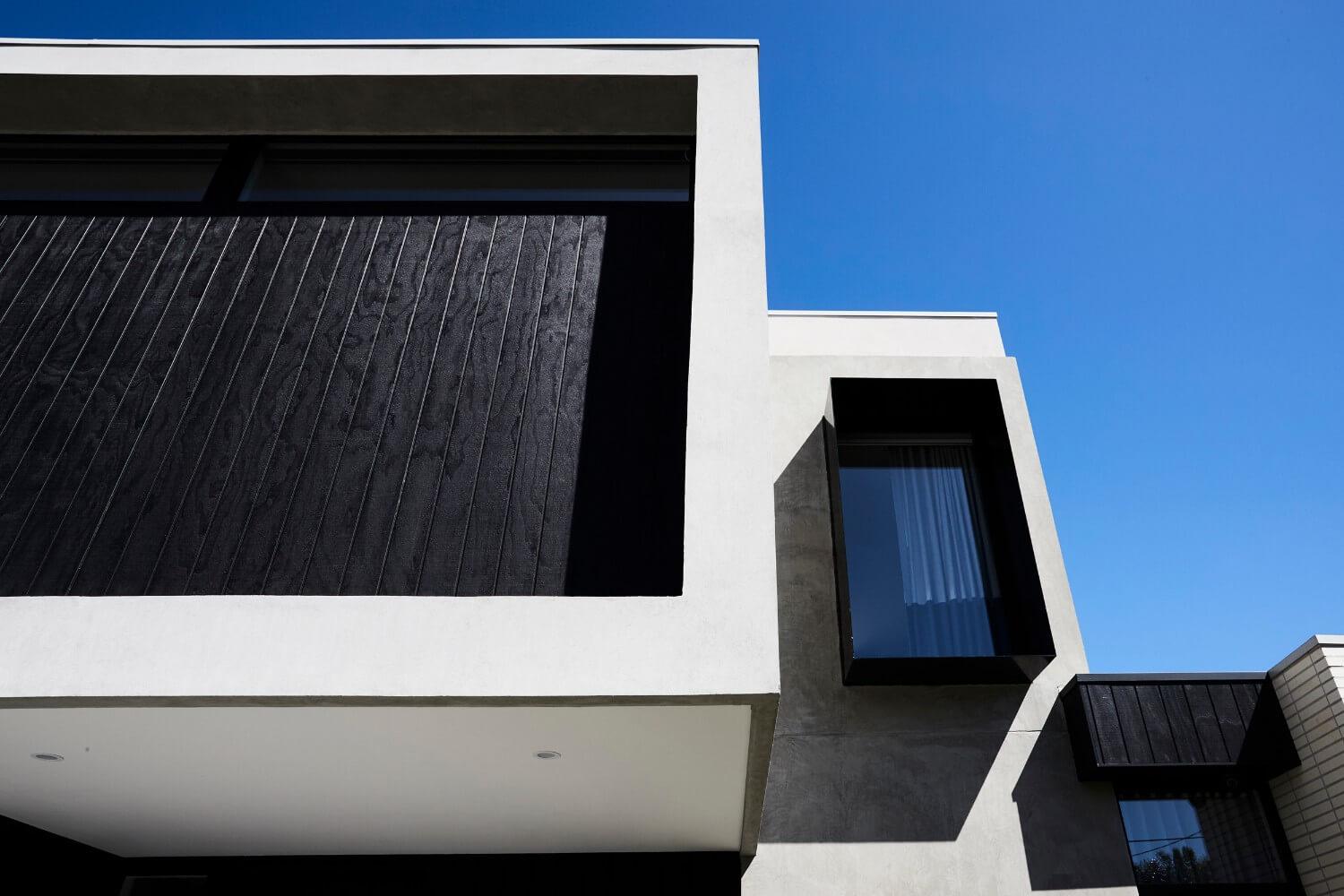 Black Timber Cladding Adds Depth And Texture To Facade