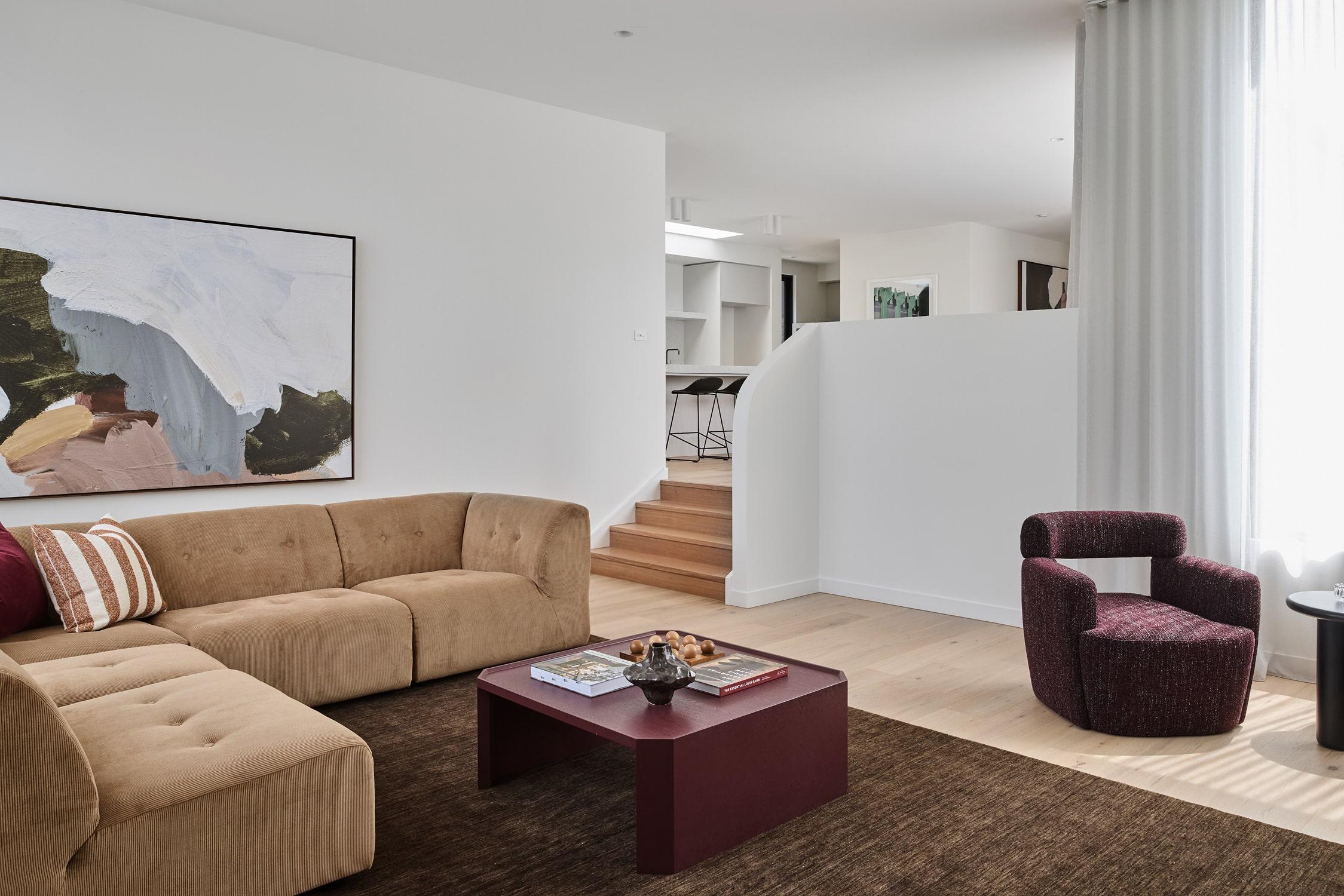 Architecturally designed sunken living room by Thomas Archer with rich coloured furniture