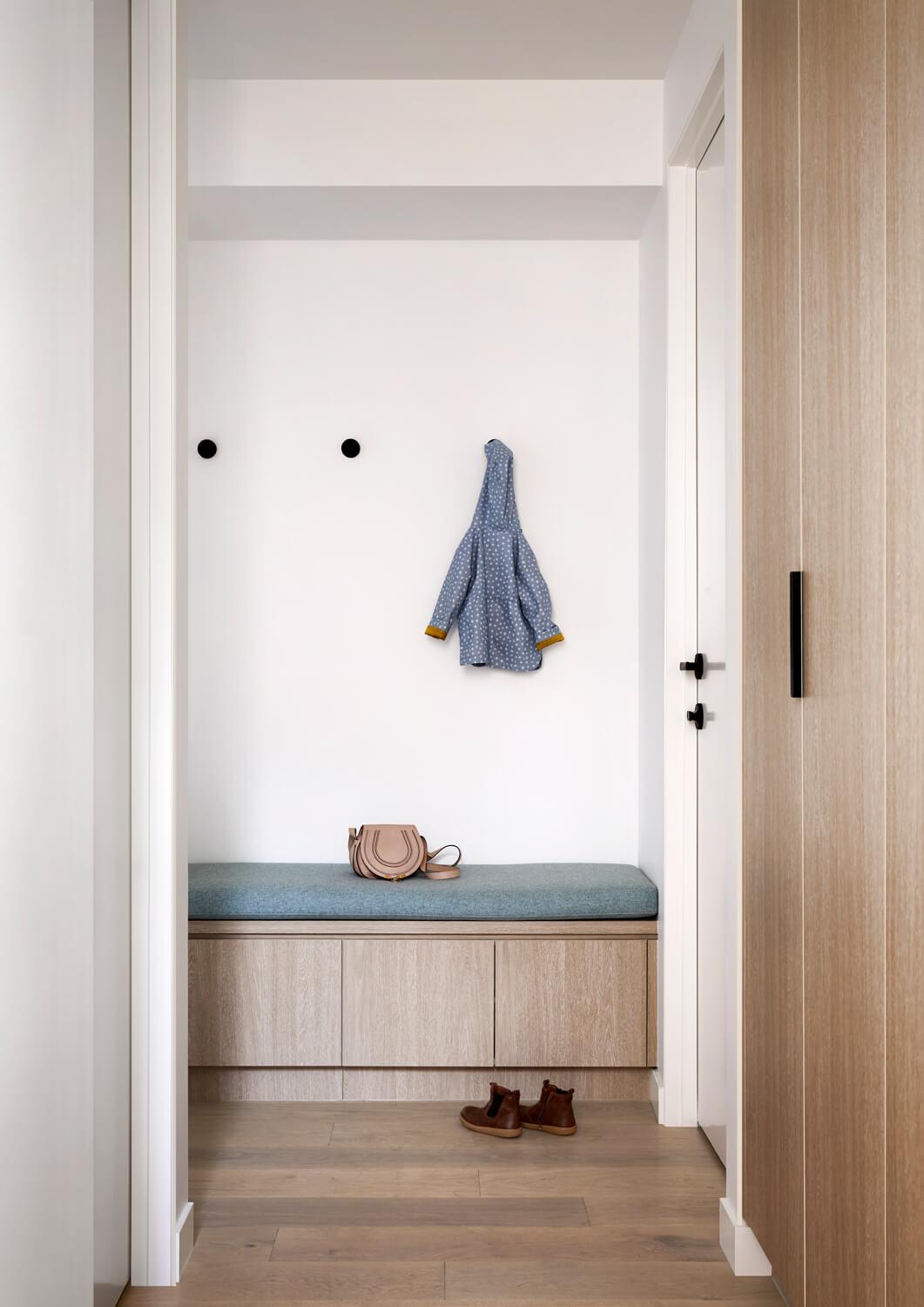 Warm Timber Cabinetry And Flooring In Mudroom