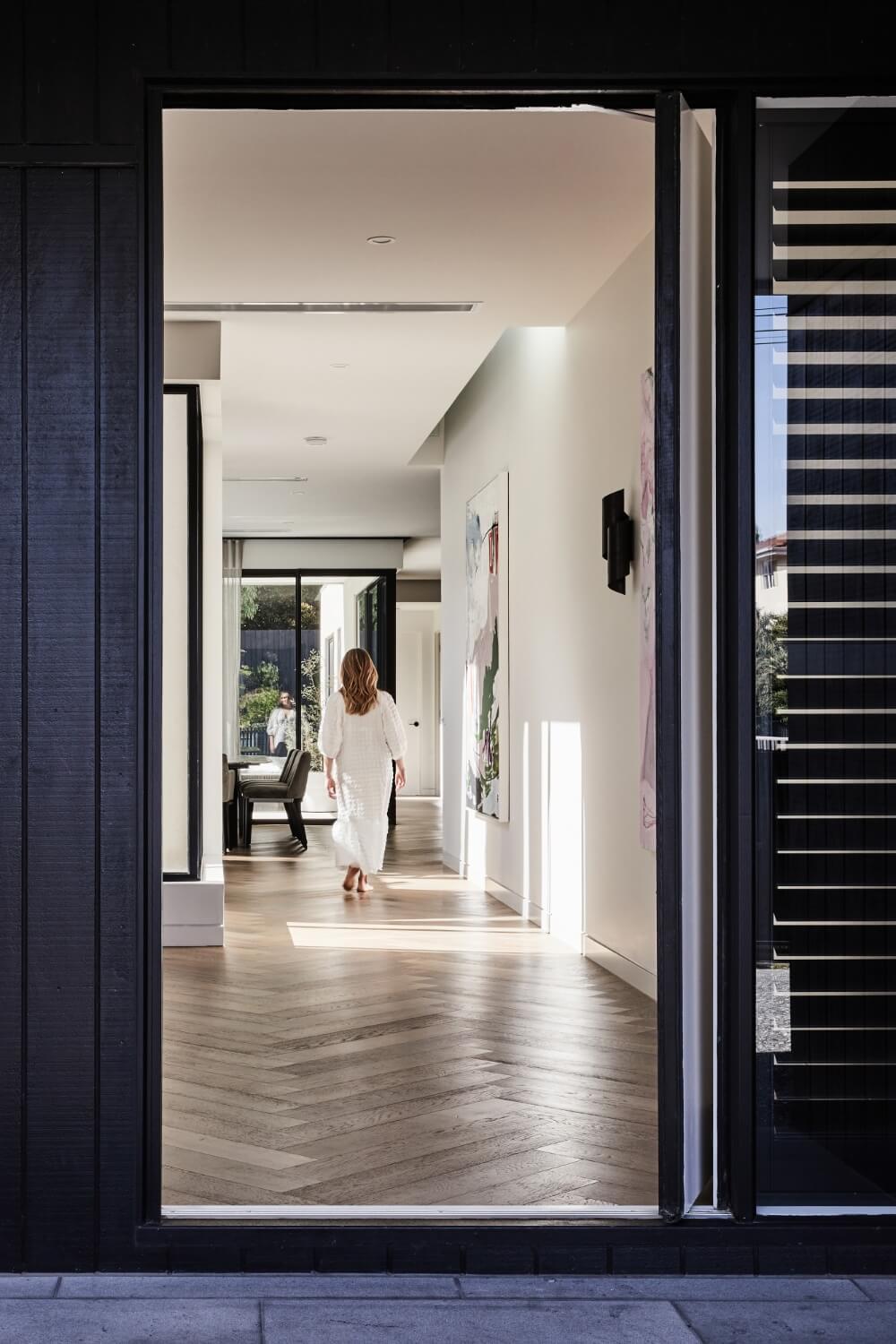 Black Pivot Door Entry To Contemporary Glen Iris Home