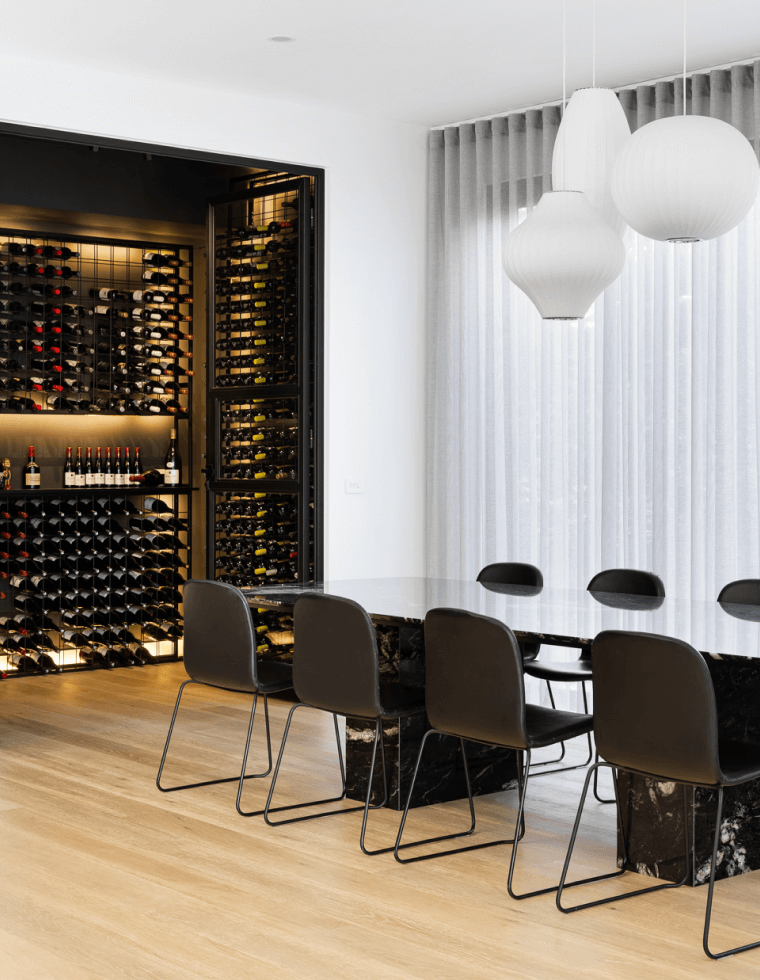 A contemporary dining space with custom built wine cellar