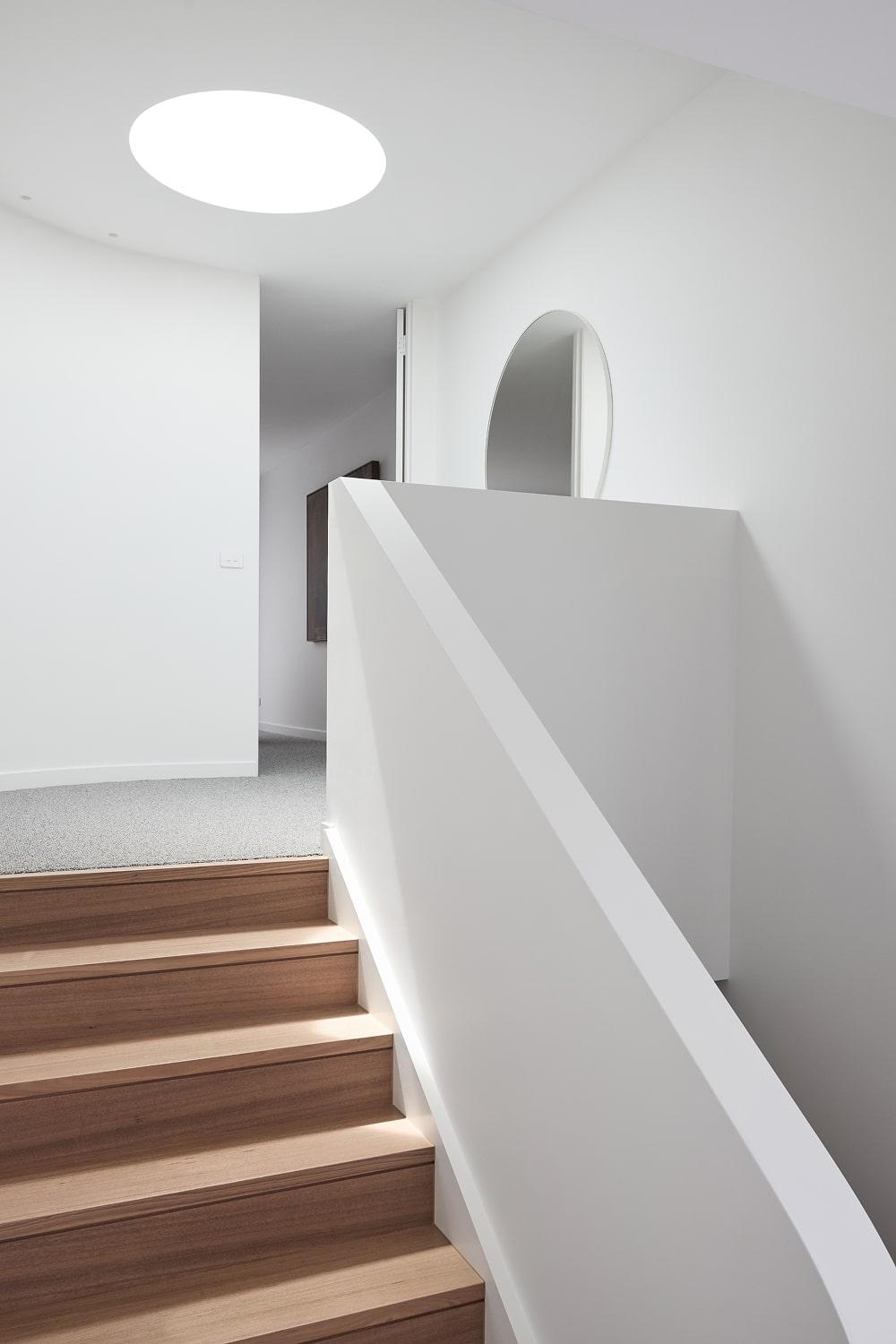 Custom stairwell with skylight architecturally designed and built by Thomas Archer