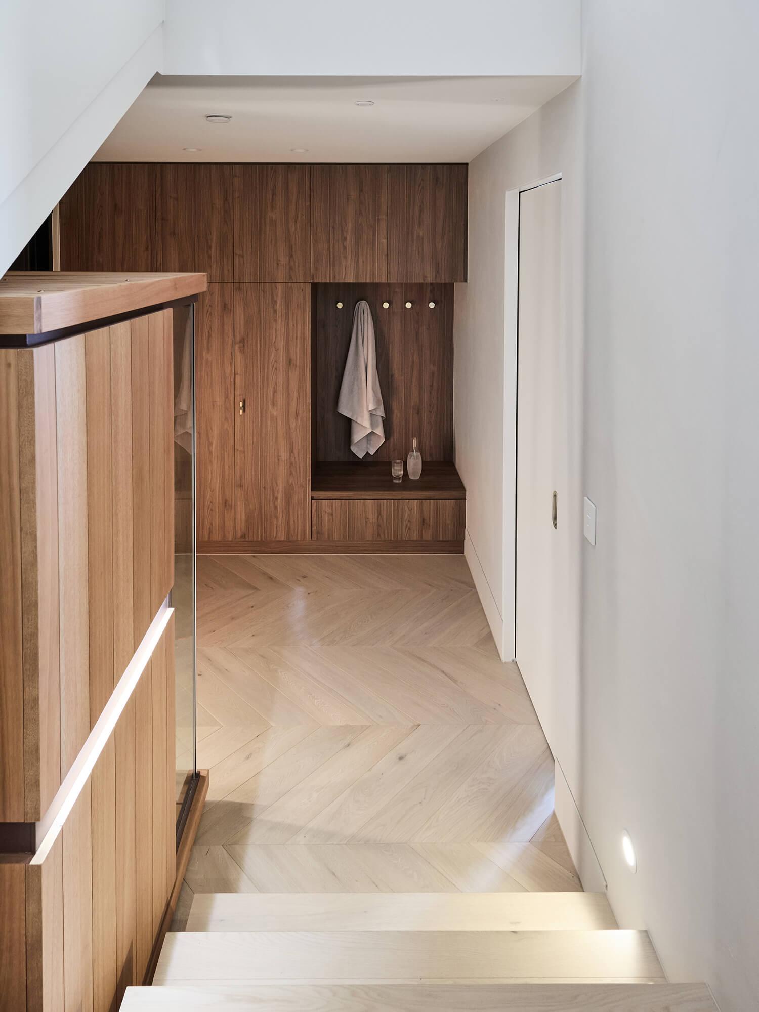 A statement foyer within the basement of a custom, architecturally designed Thomas Archer home.