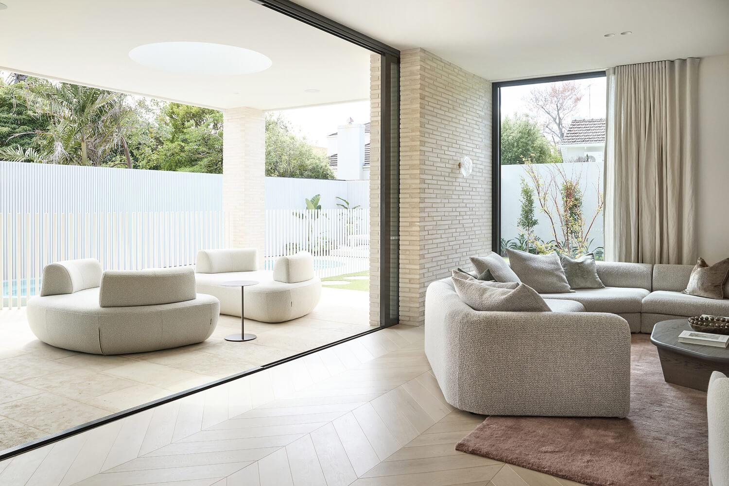 Custom architecturally designed Thomas Archer home with open-plan living and sliding doors to the outdoors.