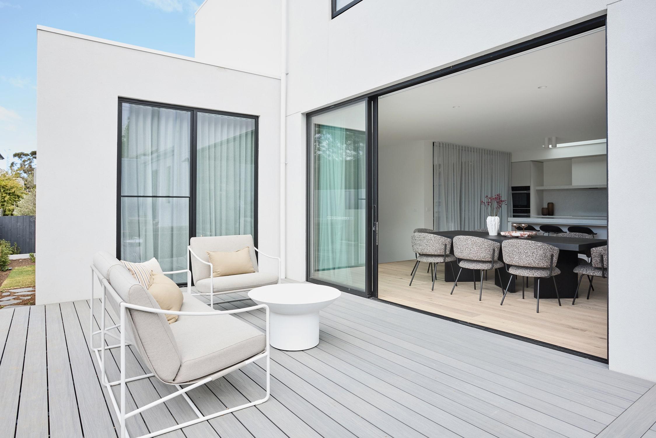 An alfresco connecting to a modern dining space custom designed and built by Thomas Archer