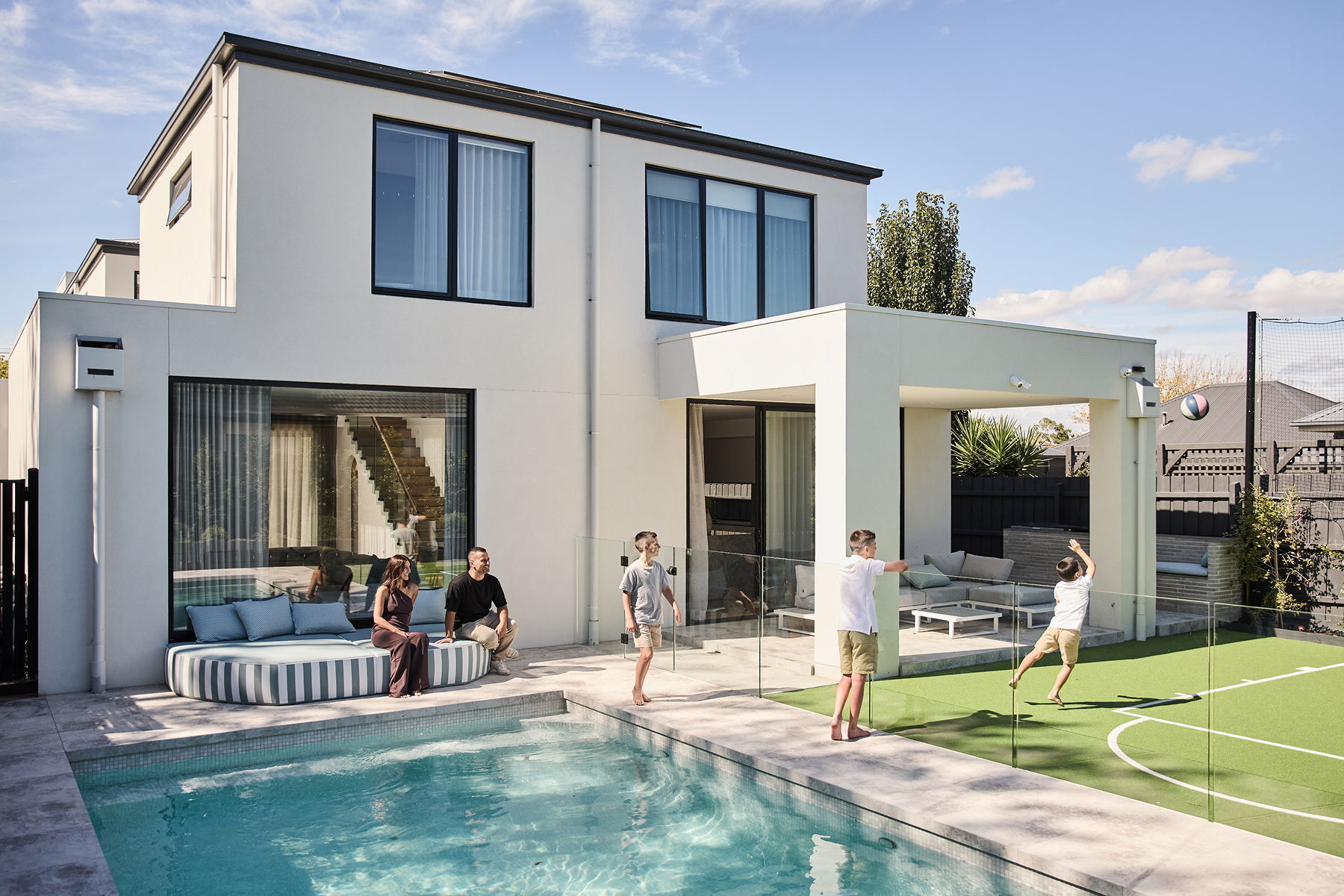 Architecturally designed modern, rear external facade with pool a by Thomas Archer