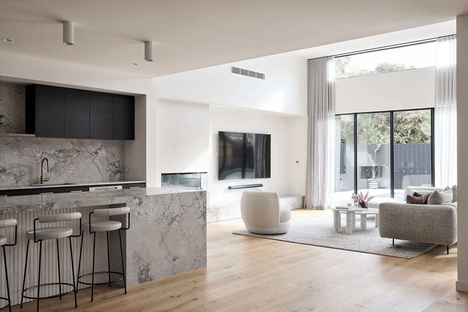 A contemporary, architecturally designed facade by Thomas Archer with landscaping in the foreground