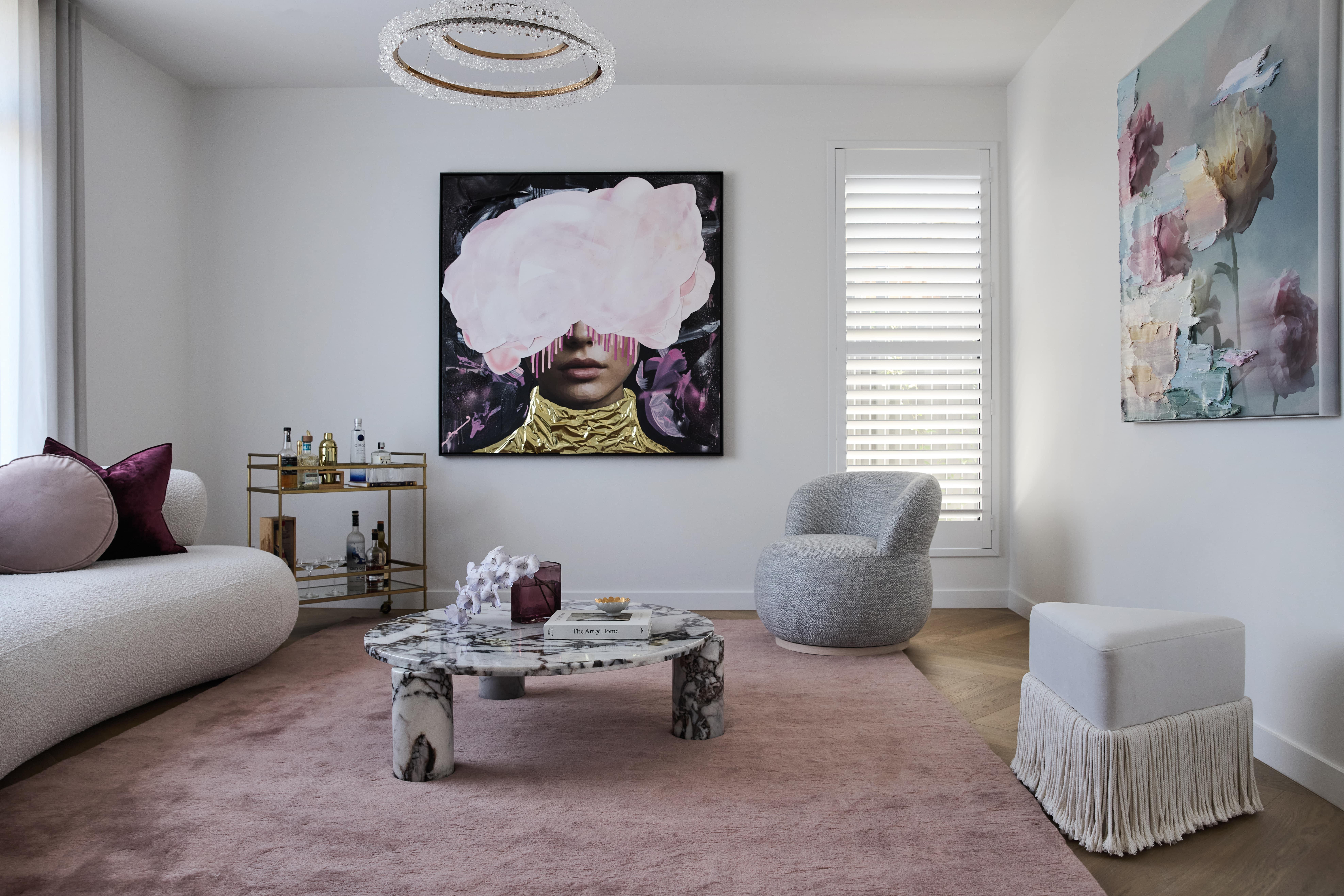 Formal lounge featuring soft, feminine tones, styled furnishings and curated artwork in our Strathmore residence