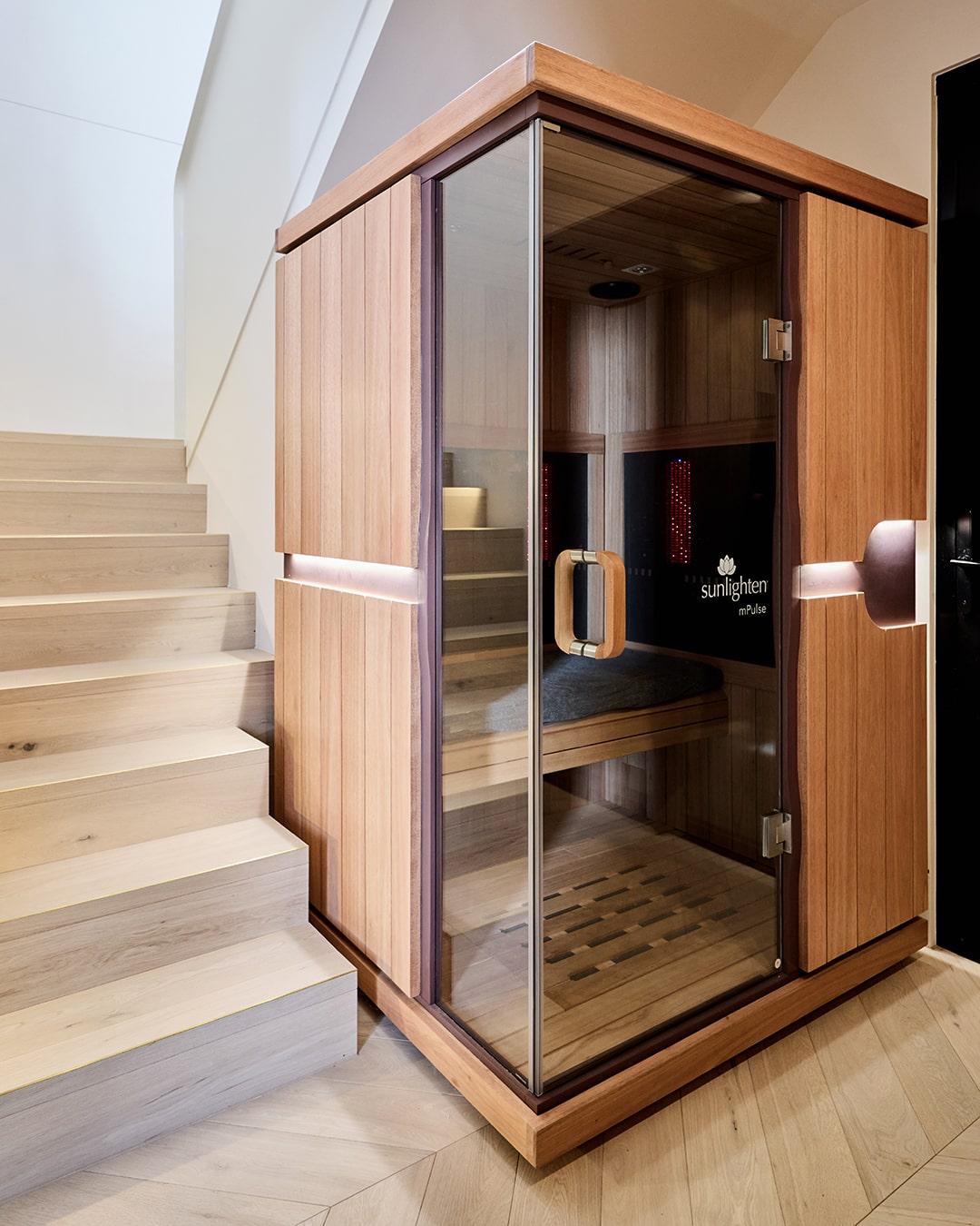 A Sunlighten Sauna in the foyer of a Thomas Archer Custom Design Home in Bayside