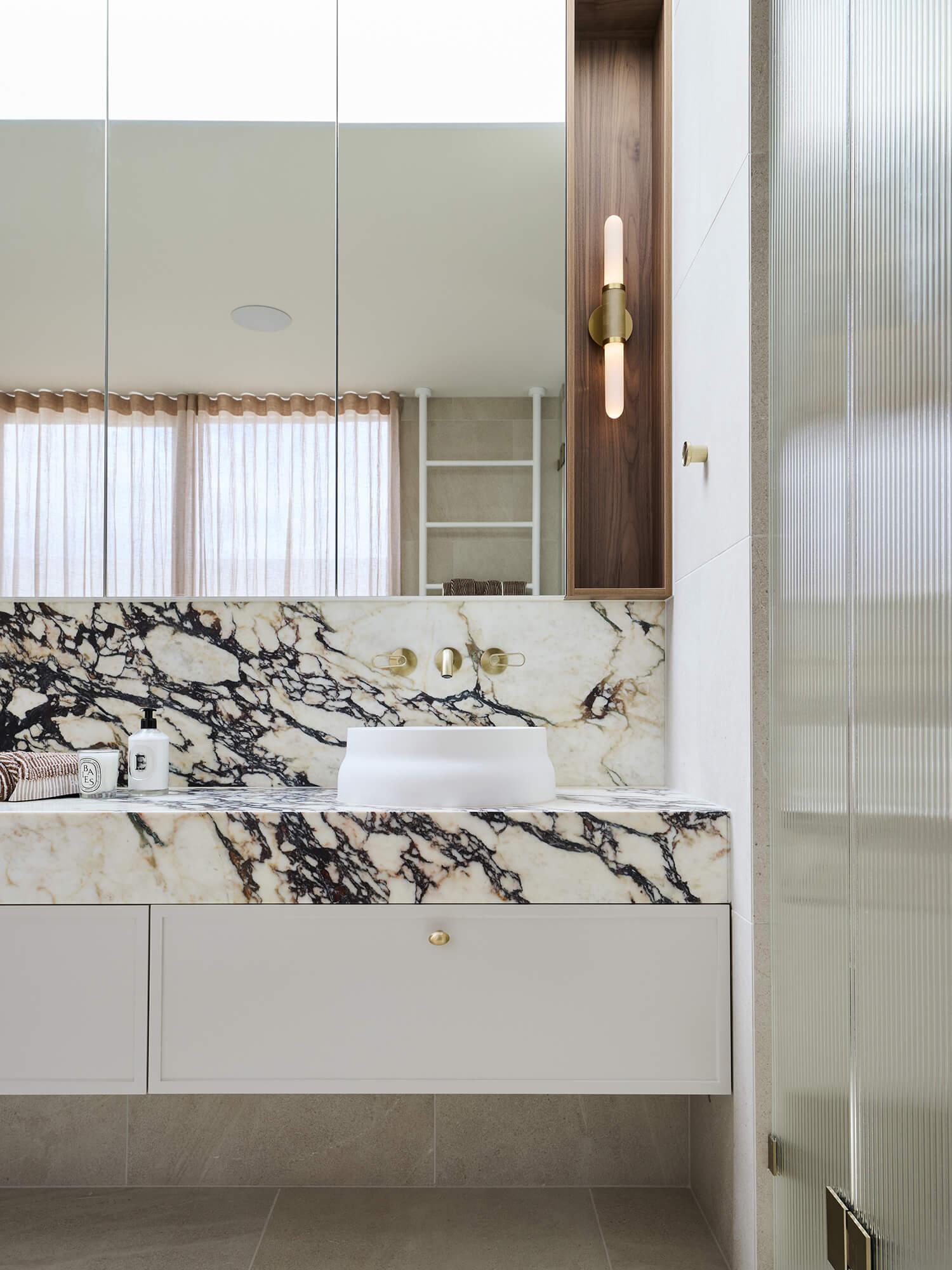 Thomas Archer custom designed ensuite with statement calacatta viola stone benchtop