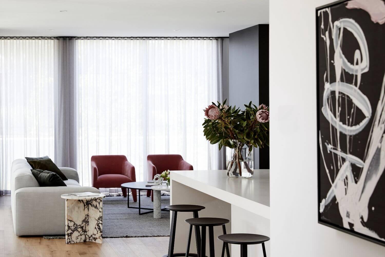 Living Room With Contemporary Artwork And Furniture