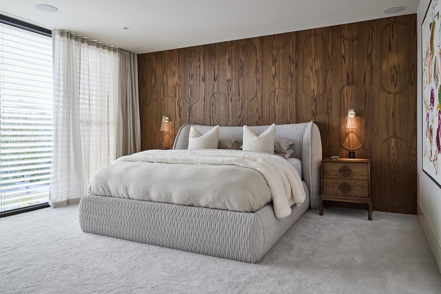 Contemporary timeless primary suite with feature walnut wall in a custom architecturally designed Thomas Archer home.