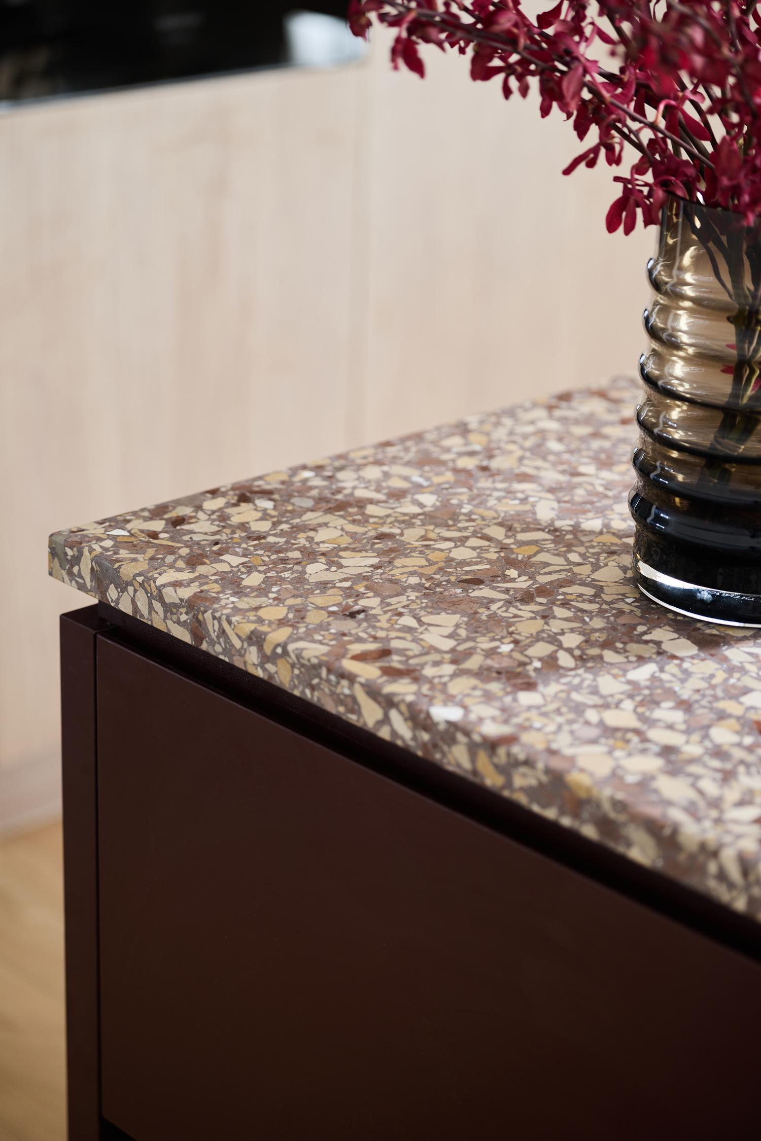 Open-plan contemporary dining and stairwell featuring, statement timber flooring, designed and built by Thomas Archer.