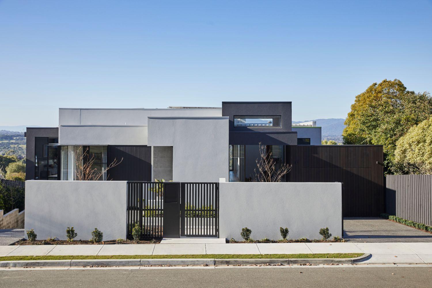 Contemporary Facade Utilising Aerated Concrete And Black Timber Cladding