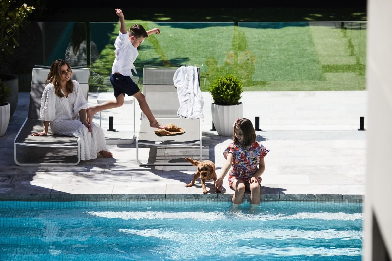 Family Enjoying Swimming Pool In Glen Iris Residence