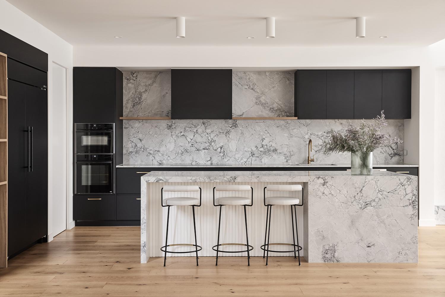 Thomas Archer architecturally designed kitchen layered with Super White Natural Stone and Contrasting Joinery