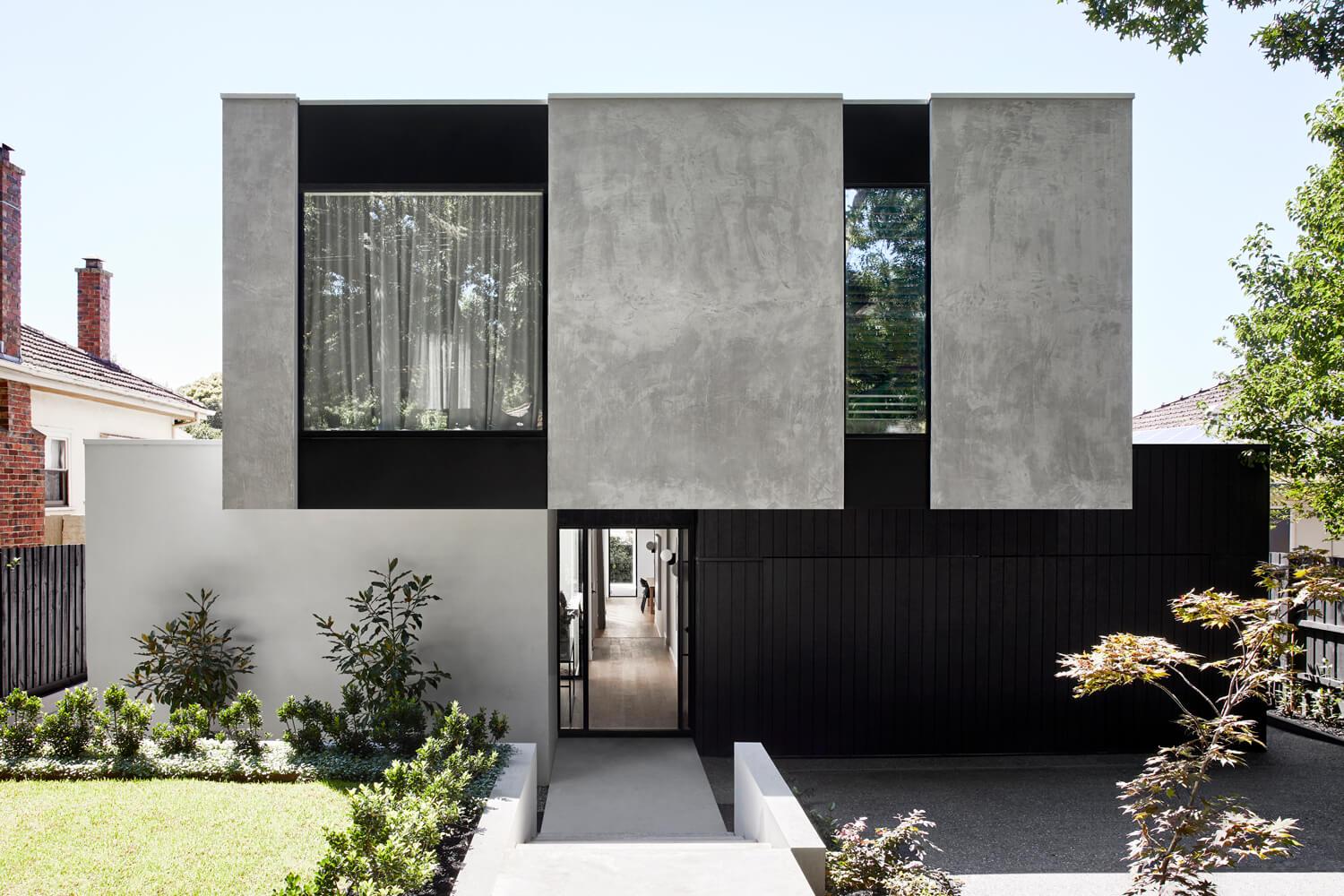 Contemporary Facade Utilising Concrete, Cladding And Brick