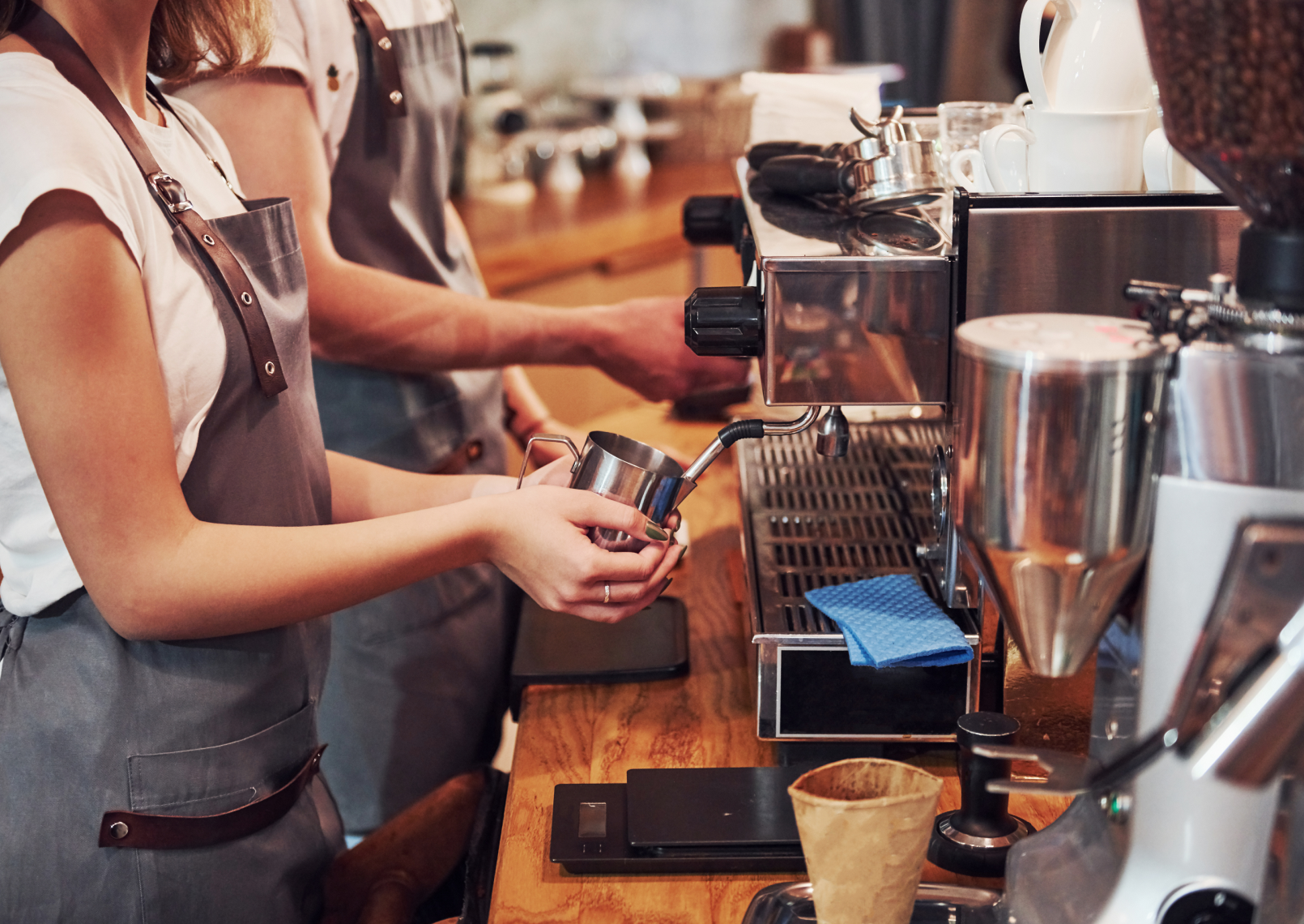 barista making coffee in cafe