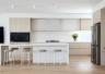 Modern kitchen with a creamy colour palette designed by Thomas Archer