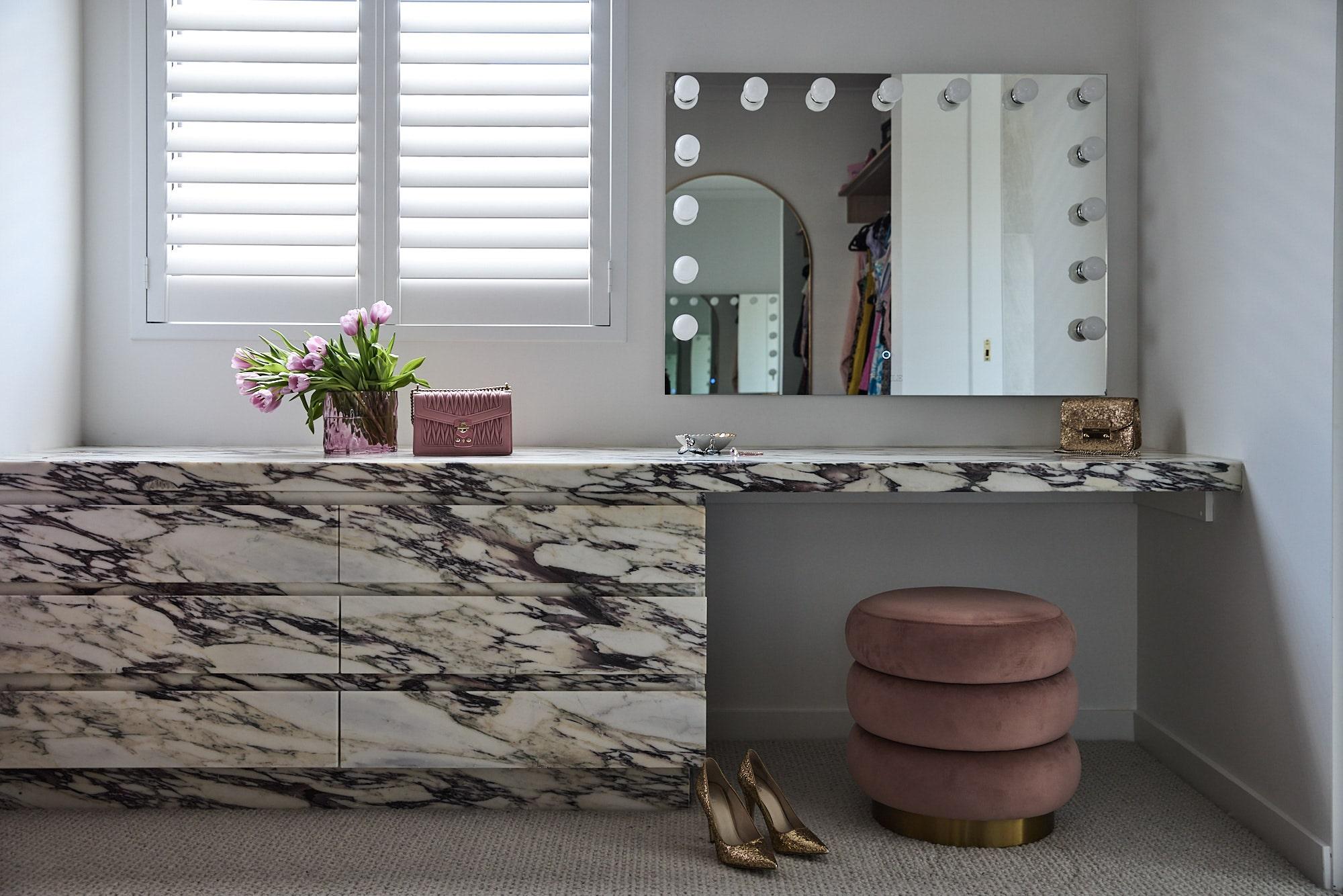 A feature custom clad calacatta viola joinery and make up nook in a thomas archer residence