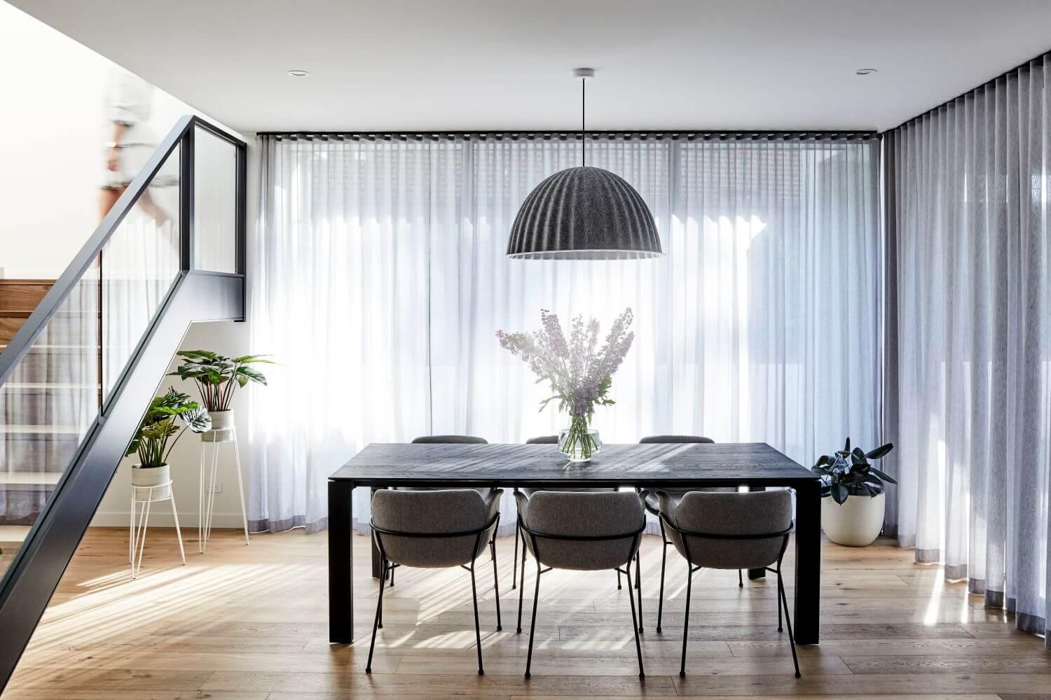 Dining Room With Modern Pendant Feature Light And Furniture