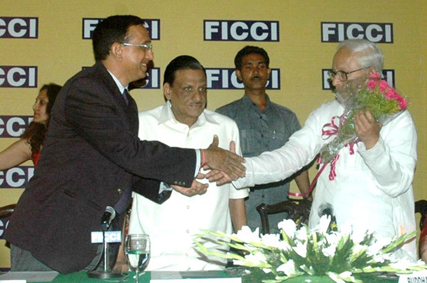 Felicitating the CM at a FICCI meet