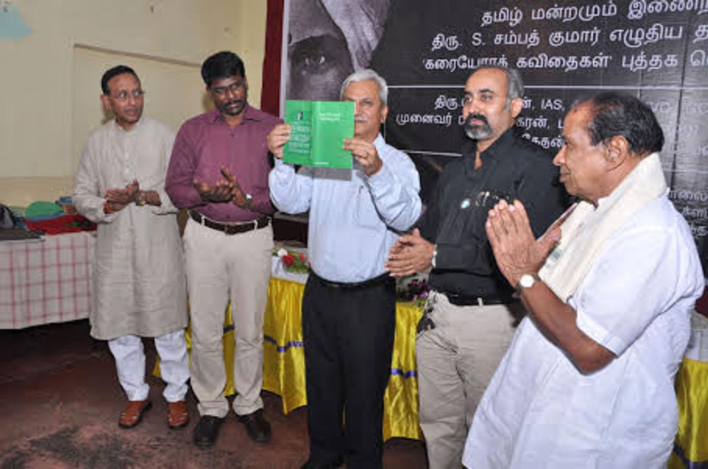 Dr. Gunasekharan releasing Karaiyorak Kavidhaigal by Kumar