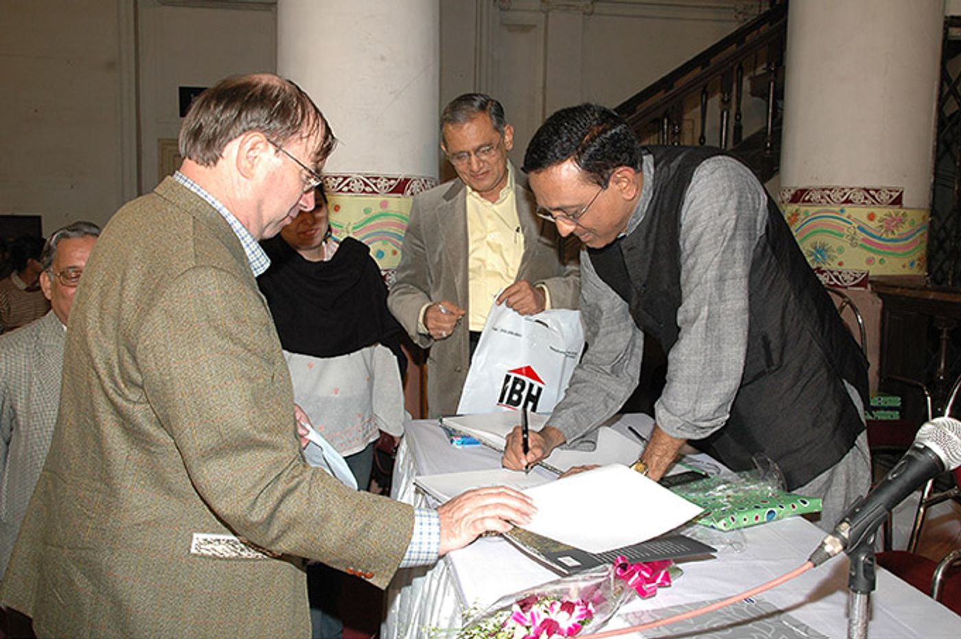 Signing a book for the German Consul General