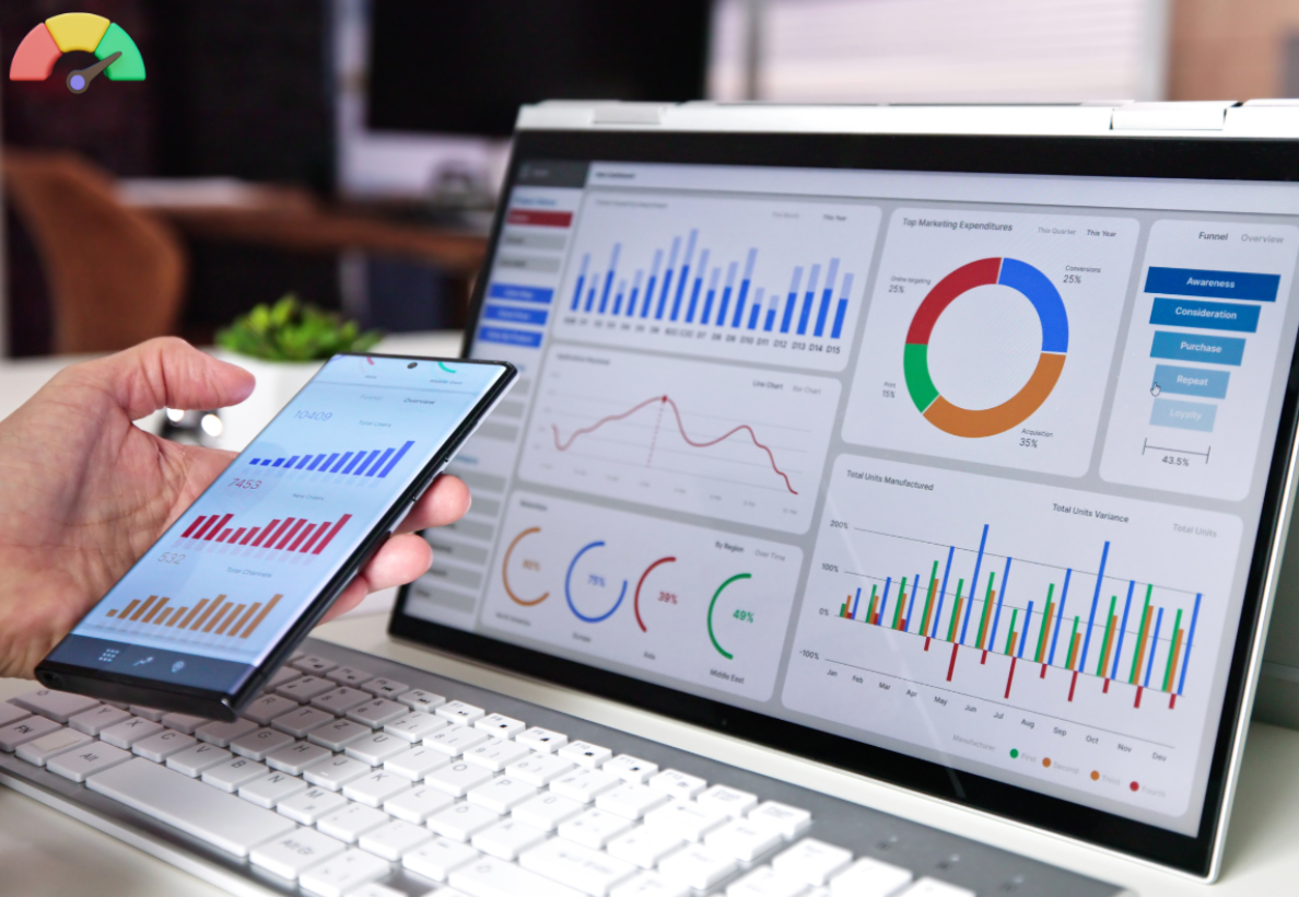  A person looking at KPIs on their phone and their laptop.