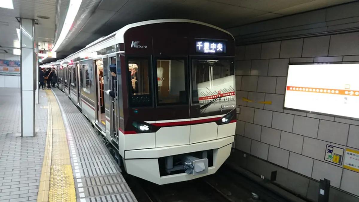 Kita-Osaka Kyuko 9000 series train 9003F at Umeda Station in Osaka