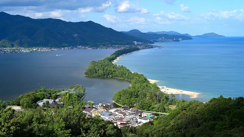 Amanohashidate sandbar between blue coastal waters in Miyazu, Kyoto, Japan