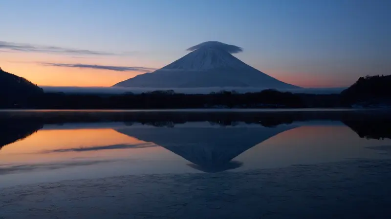Mount Fuji reflected in Lake Shoji at dawn in Yamanashi