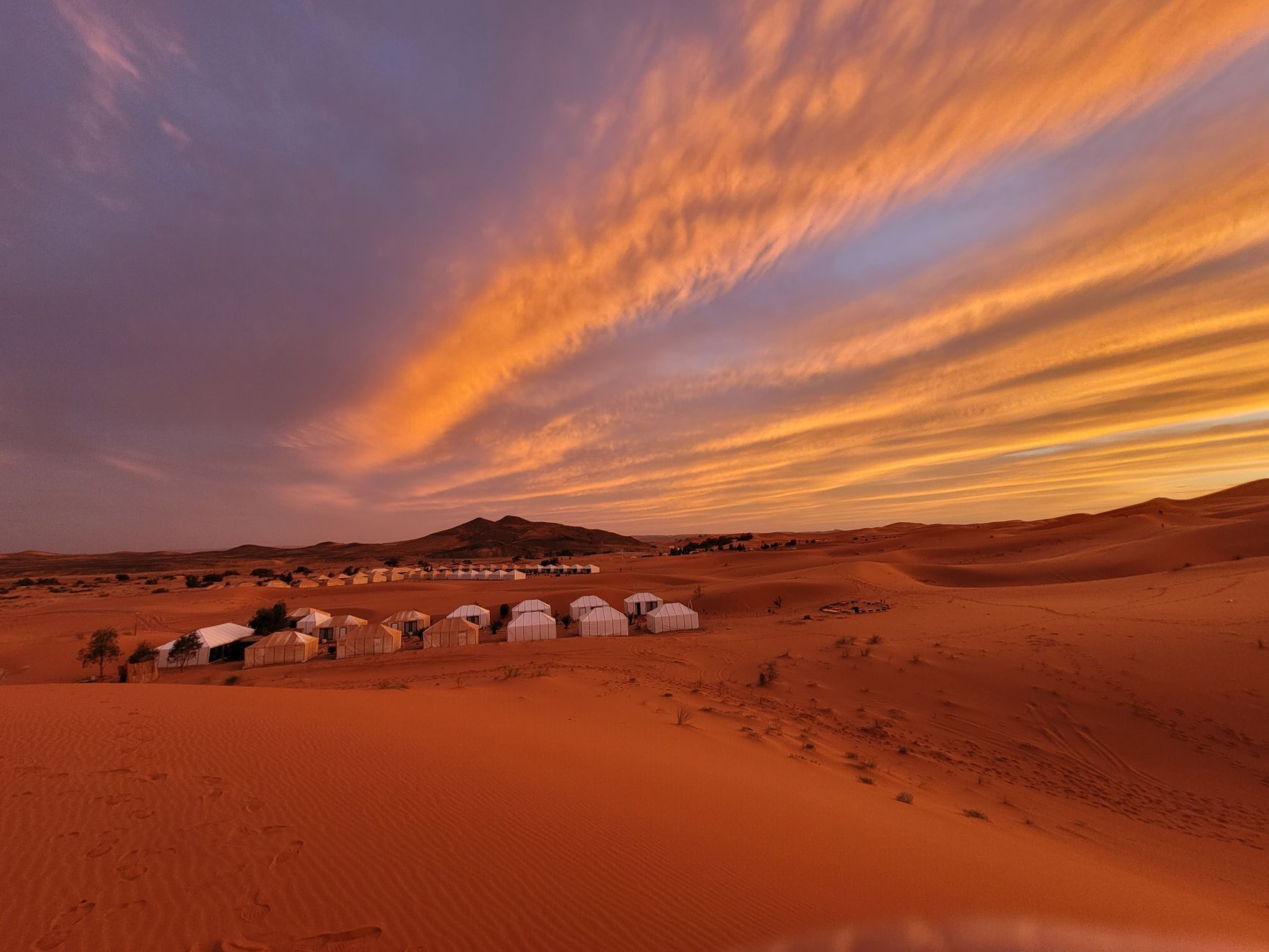Desert bivouac camp at dusk in the Sahara