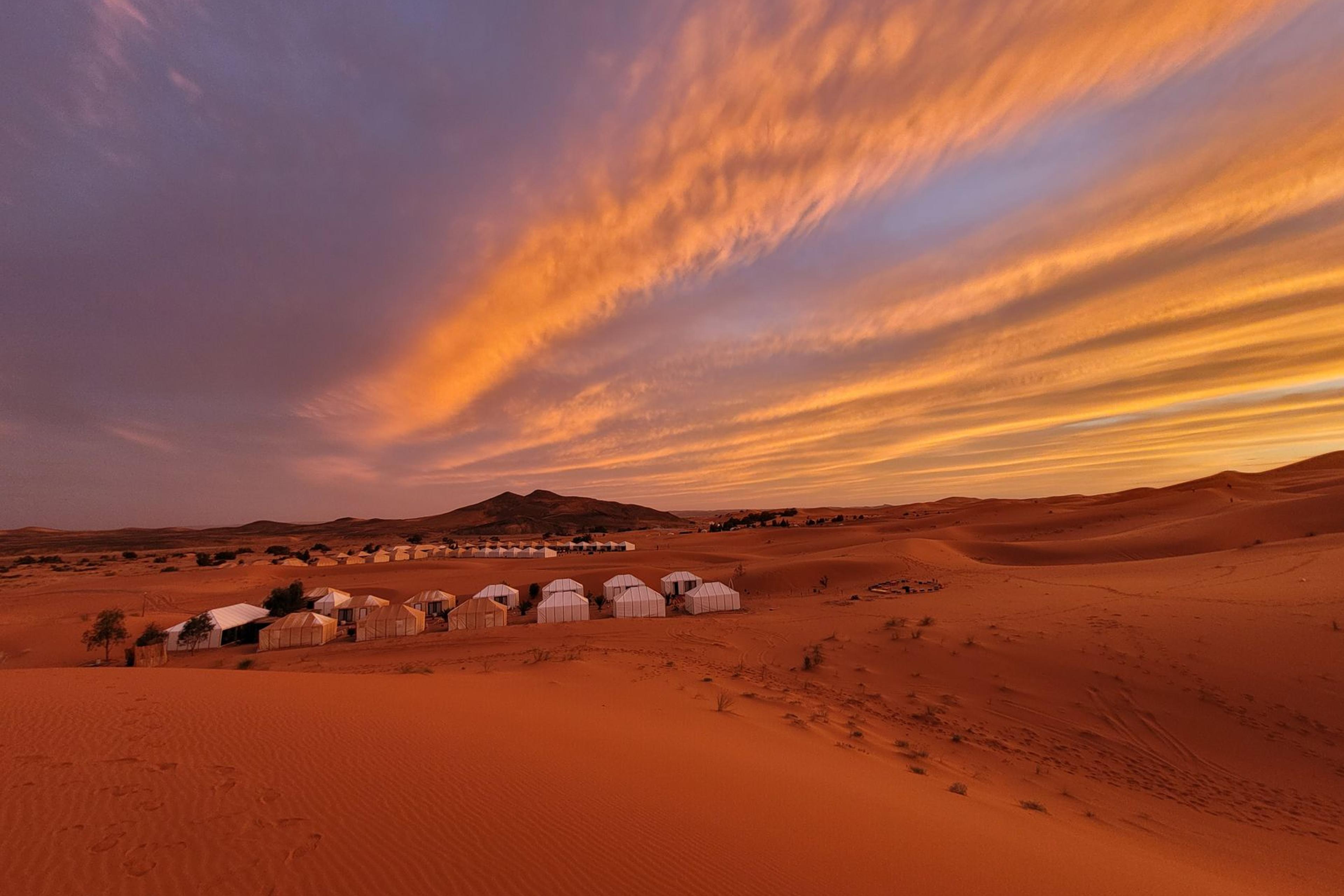 Desert bivouac camp at dusk in the Sahara