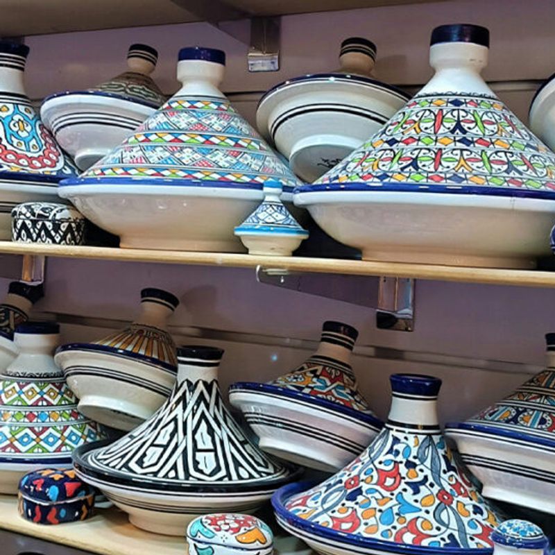 Hands polishing a finished ceramic piece