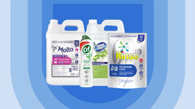 A group of four Unilever Professional cleaning product containers arranged against a blue shield background.